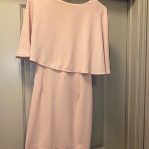 Cocktail dress has a beautiful cape and low back